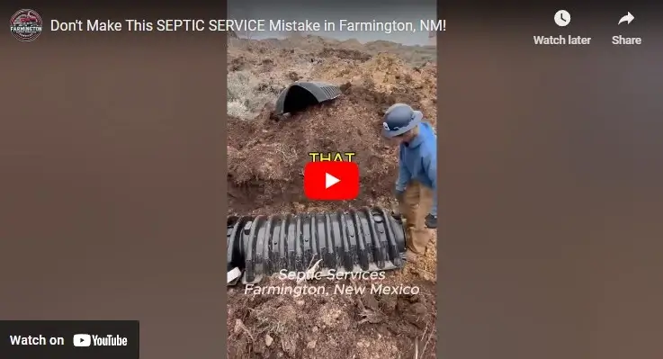worker digging out trench for septic draining.